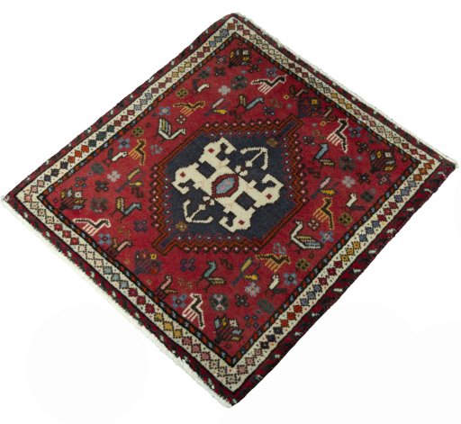 Corner detail of 2000s Shiraz rug showing border pattern and Wool pile