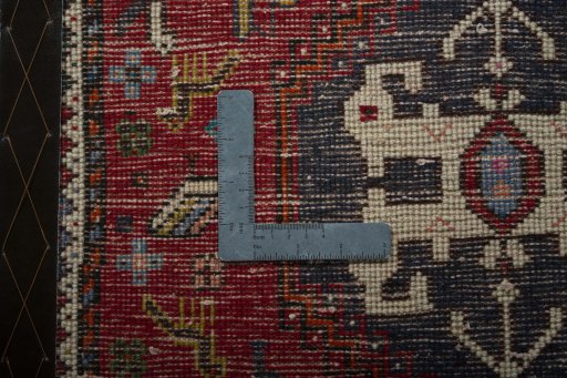 Backside of handmade 2000s Shiraz rug showing knot structure and weave density