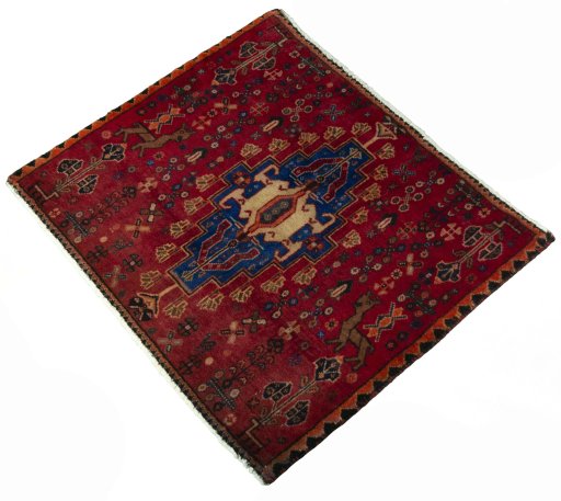 Corner detail of 2000s Shiraz rug showing border pattern and Wool pile