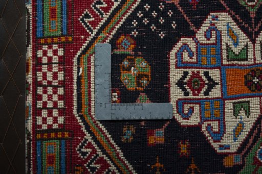 Backside of handmade 2000s Shiraz rug showing knot structure and weave density