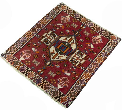 Corner detail of 2000s Shiraz rug showing border pattern and Wool pile