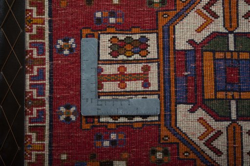 Backside of handmade 2000s Shiraz rug showing knot structure and weave density