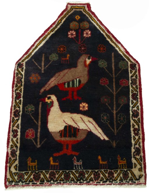 Surface texture of 2000s Shiraz rug with natural Wool and intricate pattern