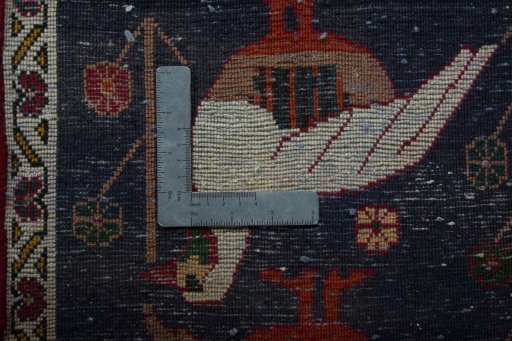 Backside of handmade 2000s Shiraz rug showing knot structure and weave density