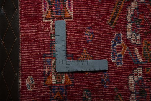 Backside of handmade 2000s Shiraz rug showing knot structure and weave density