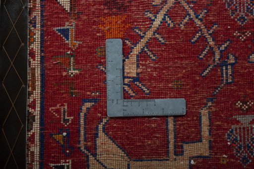 Backside of handmade 2000s Shiraz rug showing knot structure and weave density