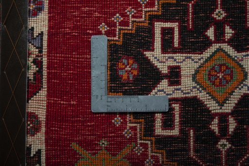 Backside of handmade 2000s Shiraz rug showing knot structure and weave density