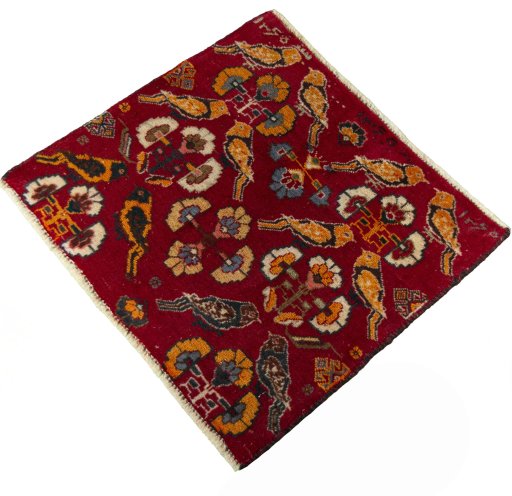 Corner detail of 2000s Shiraz rug showing border pattern and Wool pile