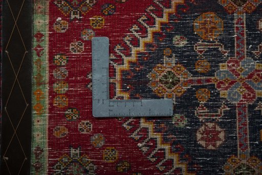 Backside of handmade 2000s Shiraz rug showing knot structure and weave density