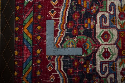 Backside of handmade 2000s Shiraz rug showing knot structure and weave density