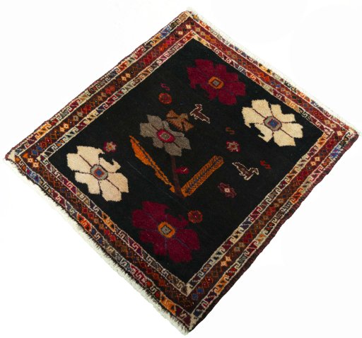 Corner detail of 2000s Shiraz rug showing border pattern and Wool pile