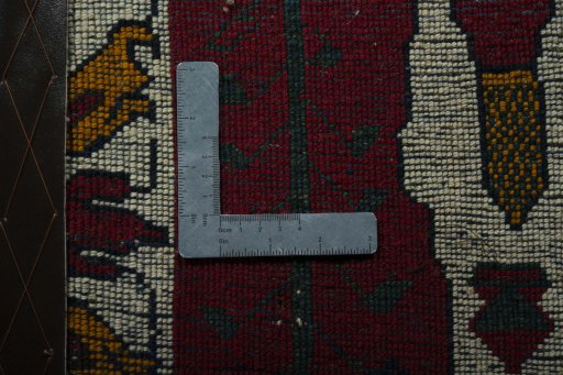 Backside of handmade 2000s Shiraz rug showing knot structure and weave density