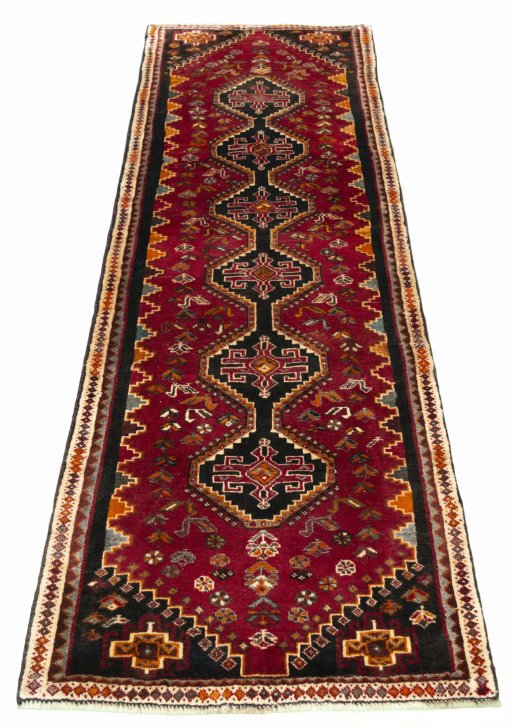 Surface texture of 2000s Shiraz rug with natural Wool and intricate pattern