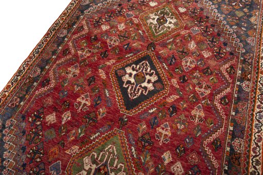 Backside of handmade 2000s Shiraz rug showing knot structure and weave density