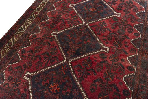 Backside of handmade 2000s Shiraz rug showing knot structure and weave density