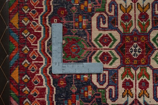 Backside of handmade 2000s Shiraz rug showing knot structure and weave density