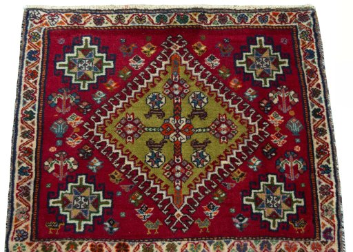 Surface texture of 2000s Shiraz rug with natural Wool and intricate pattern