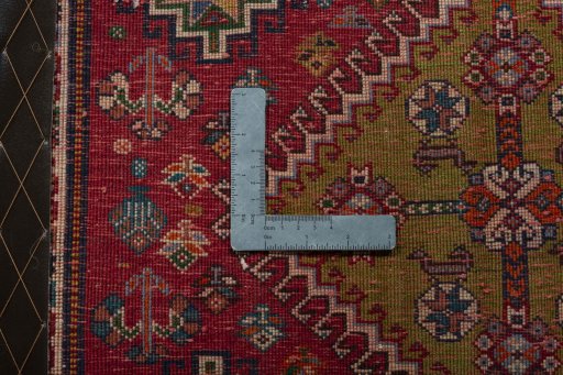 Backside of handmade 2000s Shiraz rug showing knot structure and weave density