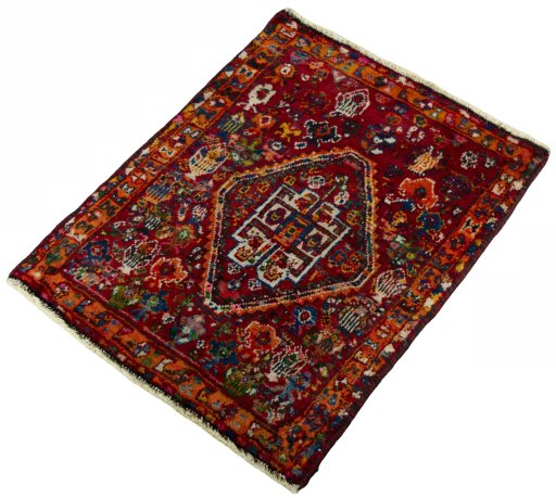 Corner detail of 2000s Shiraz rug showing border pattern and Wool pile
