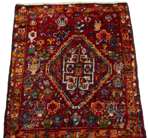 Surface texture of 2000s Shiraz rug with natural Wool and intricate pattern