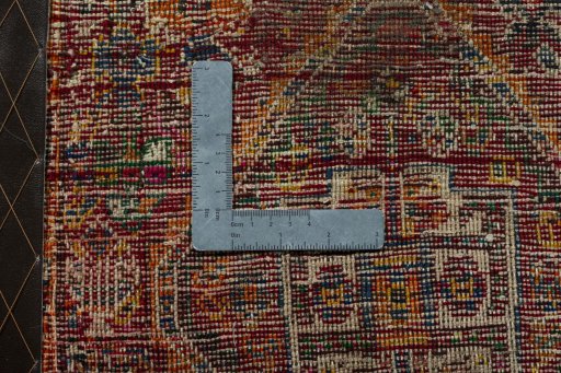 Backside of handmade 2000s Shiraz rug showing knot structure and weave density