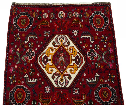 Surface texture of 2000s Shiraz rug with natural Wool and intricate pattern