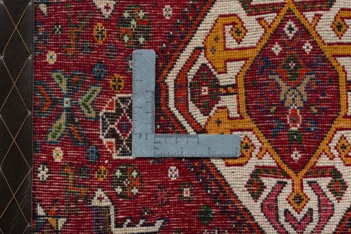 Backside of handmade 2000s Shiraz rug showing knot structure and weave density