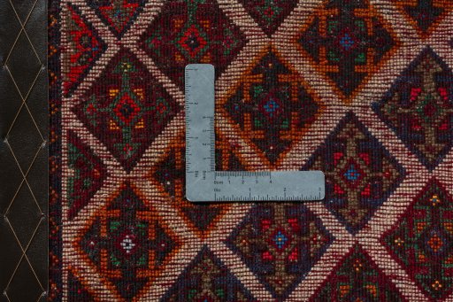 Backside of handmade 2000s Shiraz rug showing knot structure and weave density