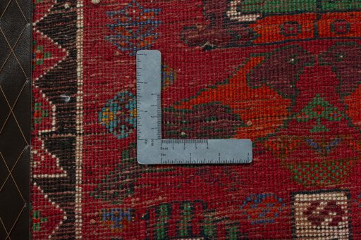 Backside of handmade 2000s Shiraz rug showing knot structure and weave density