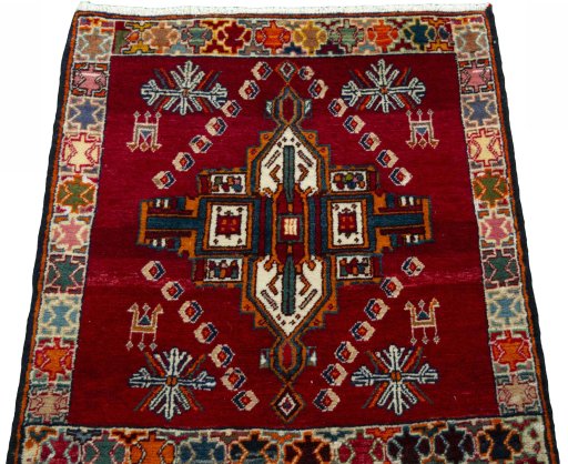 Surface texture of 2000s Shiraz rug with natural Wool and intricate pattern