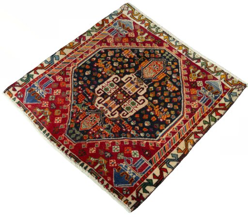 Corner detail of 2000s Shiraz rug showing border pattern and Wool pile