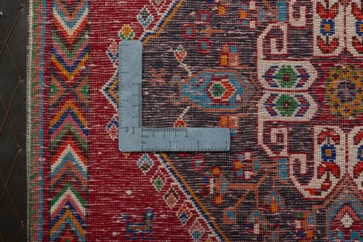 Backside of handmade 2000s Shiraz rug showing knot structure and weave density