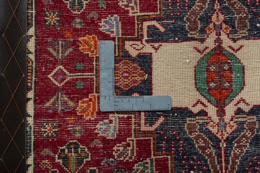 Backside of handmade 2000s Shiraz rug showing knot structure and weave density