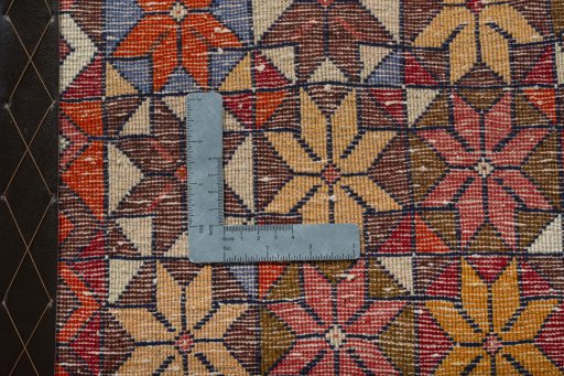 Backside of handmade 2000s Shiraz rug showing knot structure and weave density