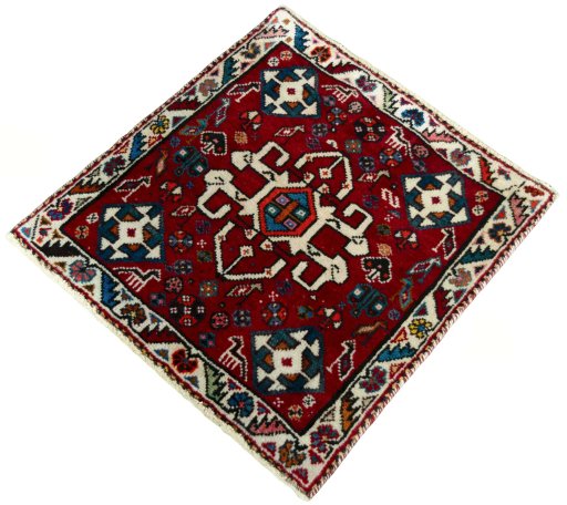 Corner detail of 2000s Shiraz rug showing border pattern and Wool pile
