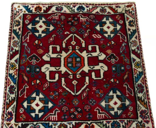 Surface texture of 2000s Shiraz rug with natural Wool and intricate pattern
