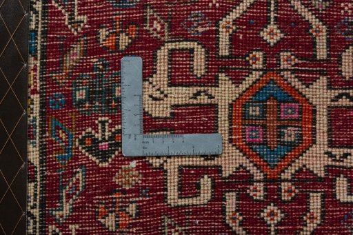 Backside of handmade 2000s Shiraz rug showing knot structure and weave density