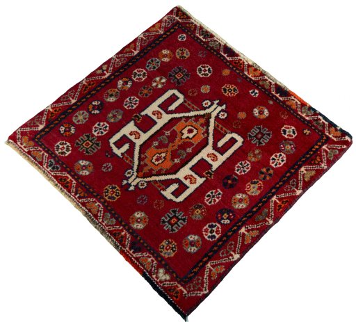 Corner detail of 2000s Shiraz rug showing border pattern and Wool pile