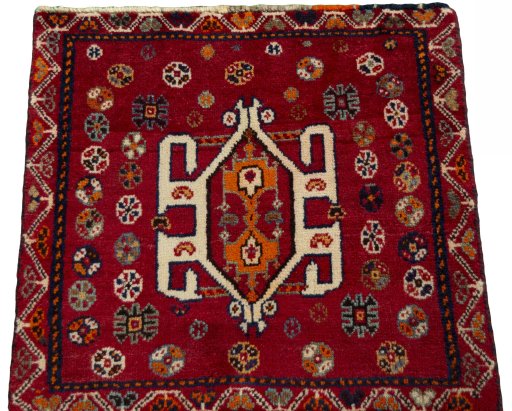 Surface texture of 2000s Shiraz rug with natural Wool and intricate pattern