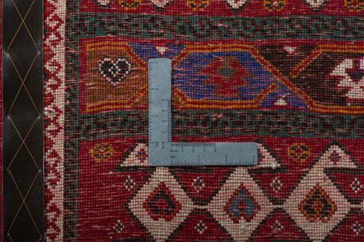 Backside of handmade 2000s Shiraz rug showing knot structure and weave density