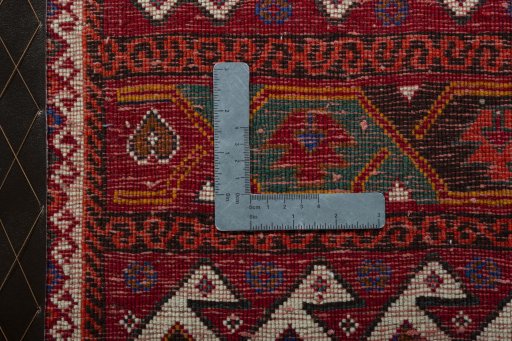 Backside of handmade 2000s Shiraz rug showing knot structure and weave density