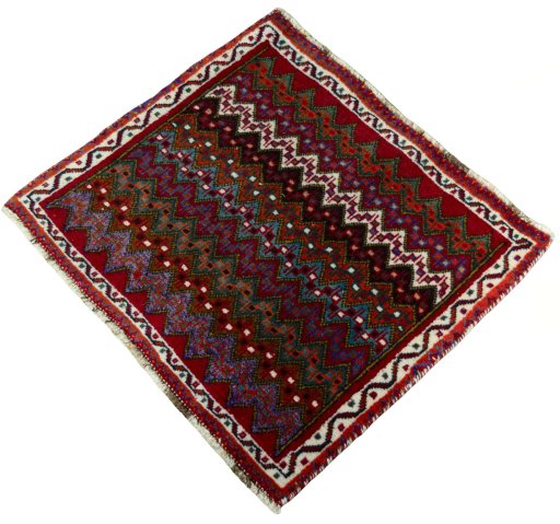 Corner detail of 2000s Shiraz rug showing border pattern and Wool pile