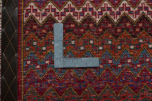 Backside of handmade 2000s Shiraz rug showing knot structure and weave density
