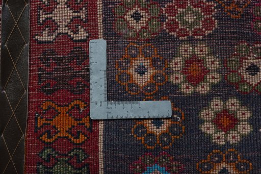 Backside of handmade 2000s Shiraz rug showing knot structure and weave density