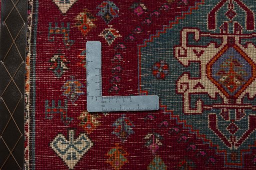 Backside of handmade 2000s Shiraz rug showing knot structure and weave density