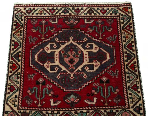 Surface texture of 2000s Shiraz rug with natural Wool and intricate pattern