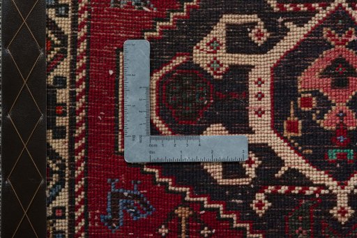 Backside of handmade 2000s Shiraz rug showing knot structure and weave density