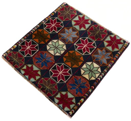 Corner detail of 2000s Shiraz rug showing border pattern and Wool pile