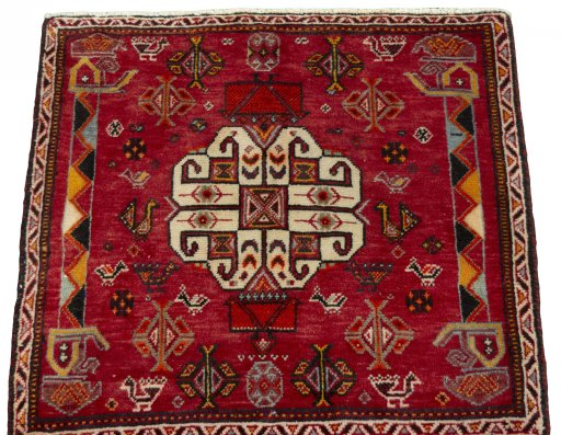 Surface texture of 2000s Shiraz rug with natural Wool and intricate pattern
