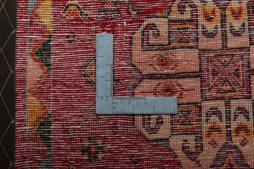 Backside of handmade 2000s Shiraz rug showing knot structure and weave density